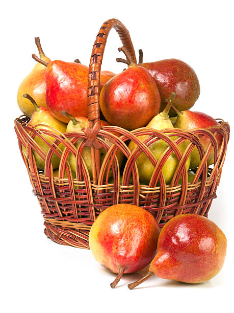istock pears in a wicker basket isolated on white background 601937360