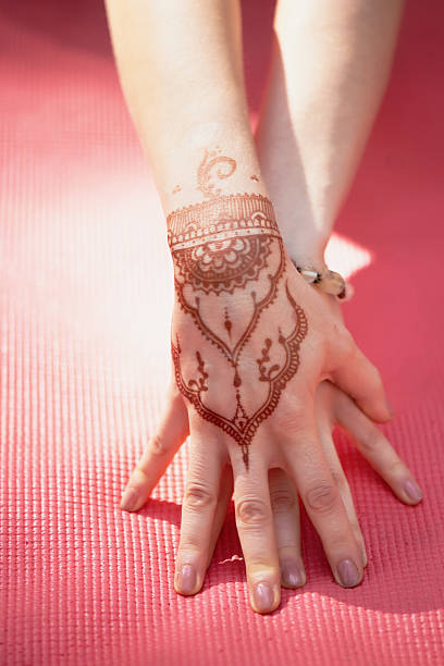 istock Hand yoga with brown henna mehendi. Harmony 601939514