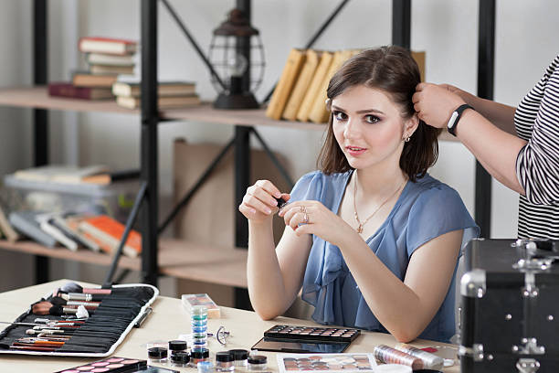 istock Beautiful brunette model sitting in dressing room 601939548