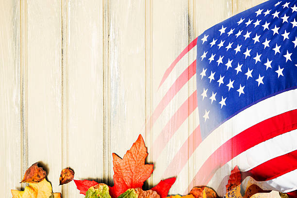 istock Red, white and blue American flag on autumn leaf background. 601939750