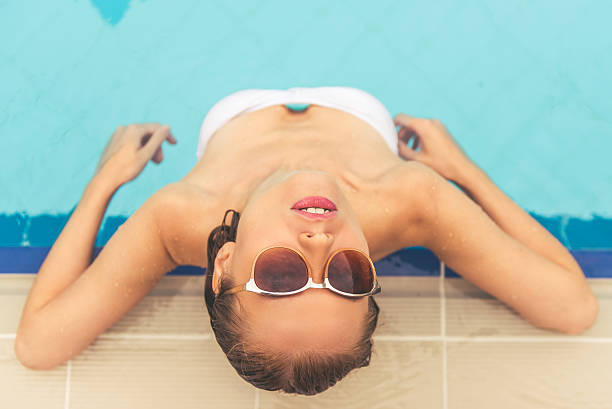 istock Attractive girl at the pool 601940778