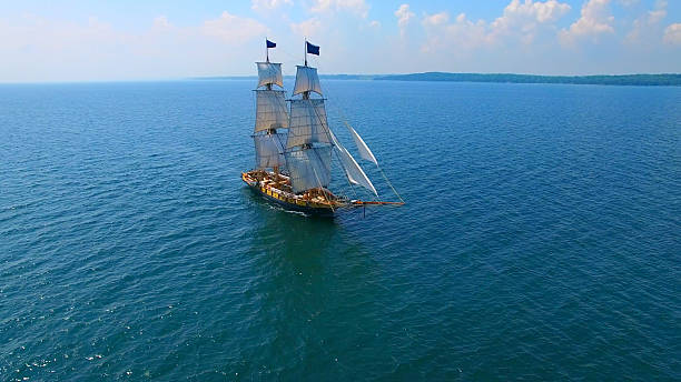 istock Beautiful tall ship sailing deep blue waters toward unseen adventures 601941568