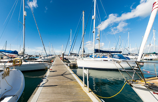 A variety of boats moored in Portland Marina by Fortuneswell in Portland, Dorset, UK. Logos and boat livery removed. No people.