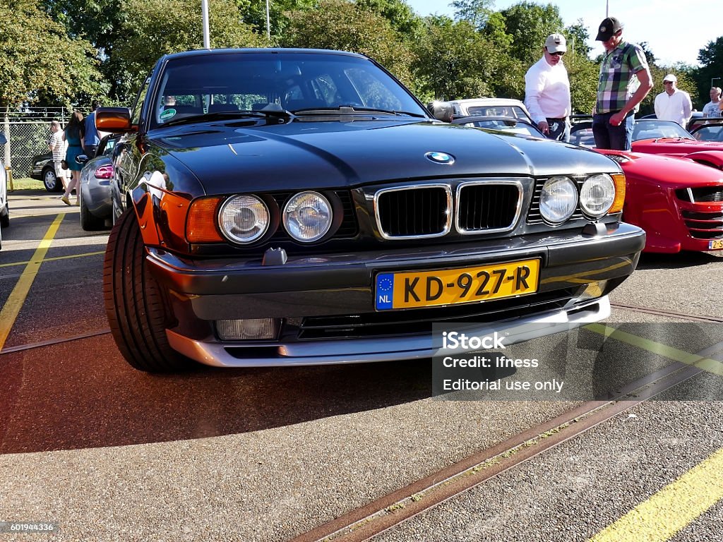 Amsterdam, The Netherlands - September 10, 2016: Black BMW M5 Amsterdam, The Netherlands - September 10, 2016: Black BMW M5 E34 Touring 1994 on display during Cars & Coffee XXL show. Non-ticketed public event held in the streets of the city with people carspotting. 1994 Stock Photo