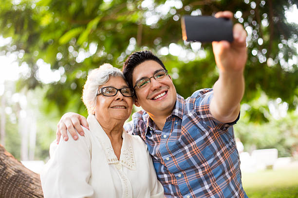 istock Affectionate grandson and grandmother taking a selfie 601945182