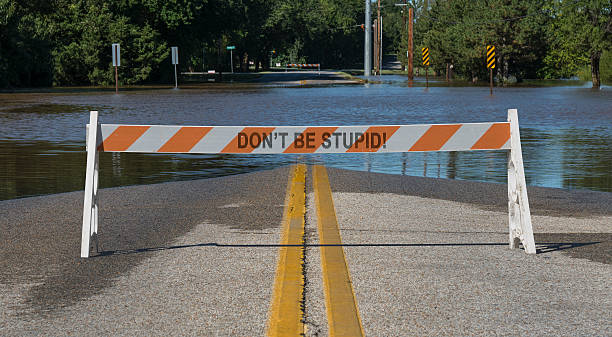 istock Street Flooding Closure Warning Sign 601945592