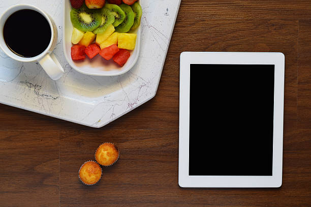 istock Top view of healthy breakfast and tablet with copyspace 601945916