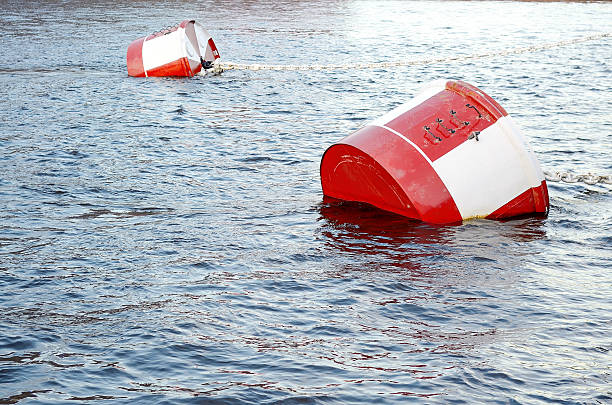 istock Red and white metal mooring buoys. 601948374