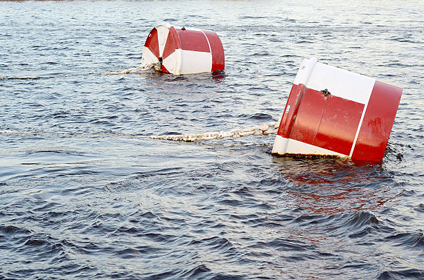 istock Red and white metal mooring buoys. 602286436