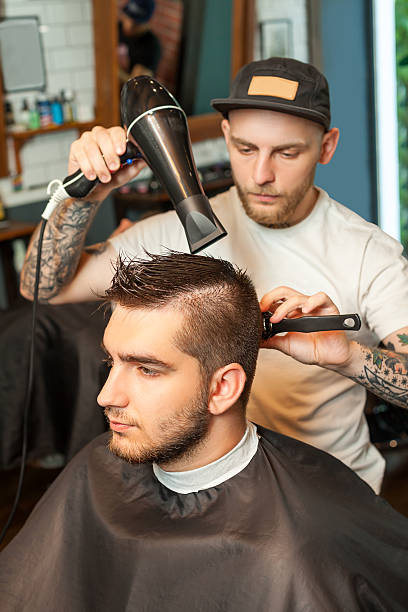 istock Young man having hair dress 602287442
