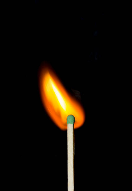 istock Ignition of a match, with smoke on dark background 602290224