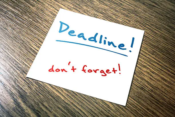Photo of Deadline Reminder On Paper Lying On Wooden Cupboard