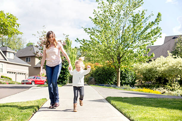 istock Young mother and daughter taking a walk 602293898