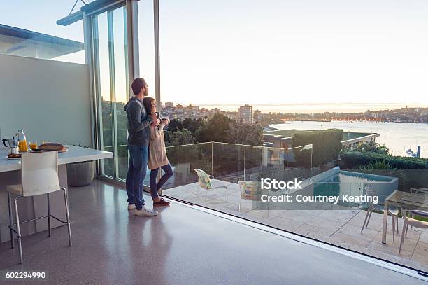 Couple Having Breakfast Together At Home Stock Photo - Download Image Now - Luxury, Domestic Life, Looking At View
