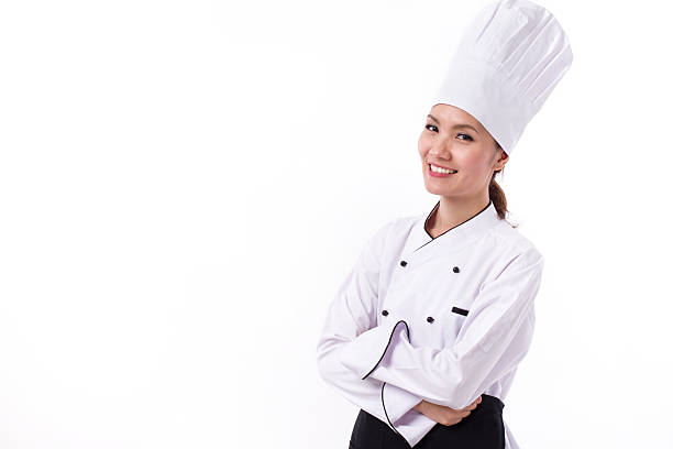 istock happy, smiling, positive female chef, arm crossing gesture 602297298
