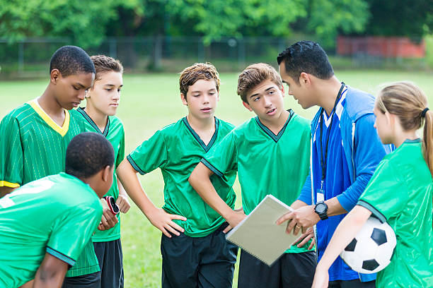 istock Soccer team during time out with coach 602298264