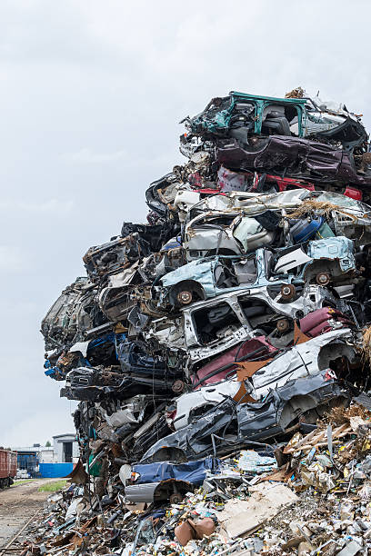 istock Stacked automobile industrial area. Dumping ground. Scrap metal heap. 602300476