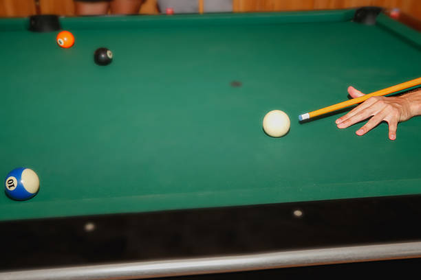 istock Adult woman playing billiard 602301440