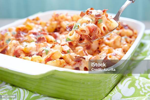 Pasta Casserole With Bacon Ham Cheese And Tomato Stock Photo - Download Image Now - Baked, Casserole, Cheese