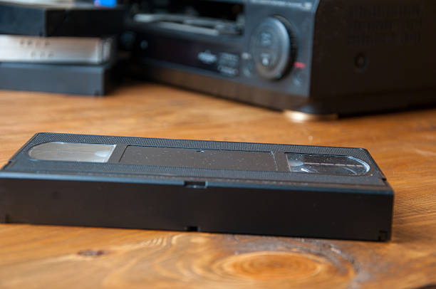 istock Equipment for playing VHS tapes on a wooden table 602303974
