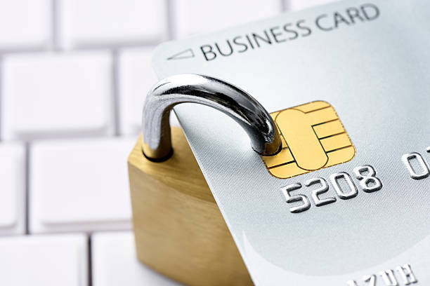 istock Close-up of credit card with locked padlock on computer keyboard 602304784