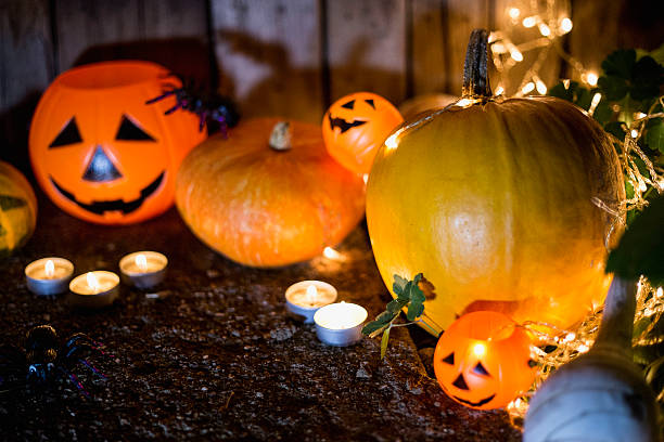 istock Halloween pumpkin head jack lantern on wooden background 602305494