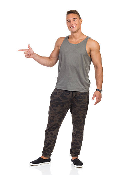 istock Smiling Military Man Pointing And Smiling 602305540
