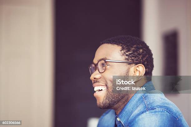 Afro American Young Man Smiling Side View Stock Photo - Download Image Now - African-American Ethnicity, Human Face, Men