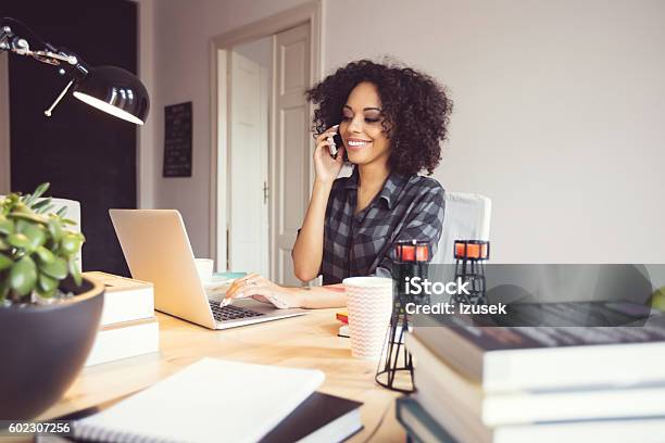 Afro Young Woman In The Home Office Using Laptop Stock Photo - Download Image Now - Office, One Woman Only, Women
