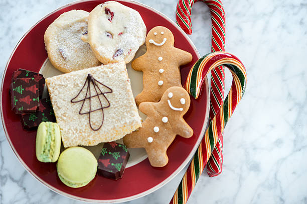 istock Red Christmas Plate, Homemade Cookies, Baking, Candy on Marble Background 602309402