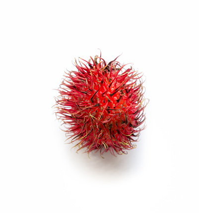 Rambutan fruit. Peeled rambutan in a bowl on white background. Bunch of rambutan fruit. Close up, Selective focus.