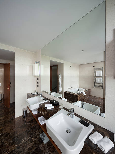 istock Modern bathroom interior with double sink and view 602313820