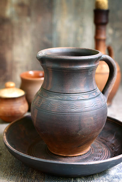 istock Homemade pottery on a rustic wooden background . 602313998
