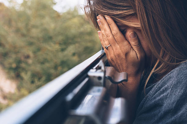 Depressed young woman in the train