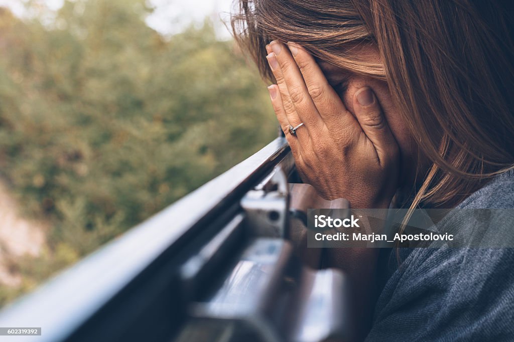 Depressed young woman in the train Abuse Stock Photo