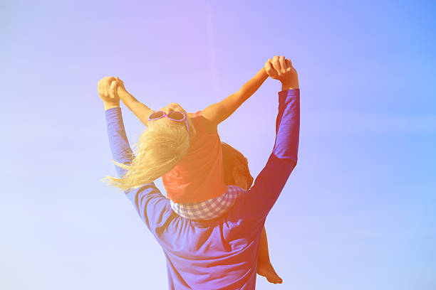 istock father and little daughter play at sky 602321330