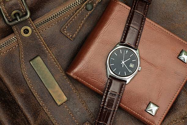 istock Vintage watch on a brown leather wallet 602322680