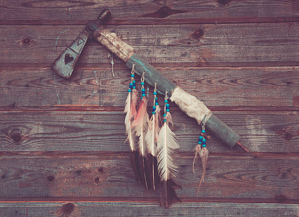 axe indians on a wooden wall stock photo