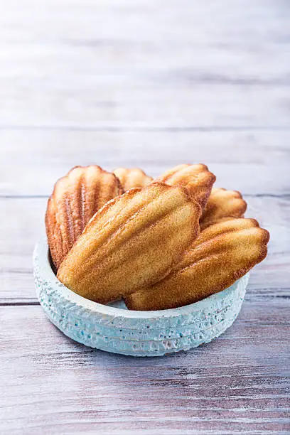 Homemade anise cookies Madeleine on old white background. Holidays food. Copy space for text.