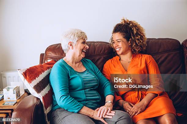 Giggles With Grandma Stock Photo - Download Image Now - Senior Adult, Home Caregiver, Friendship