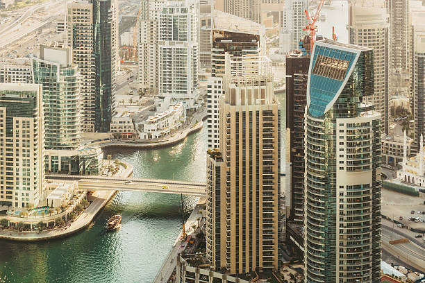 Scenic view over Dubai Marina harbor at daytime with skyscrapers
