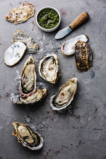 istock Open Oysters with green salsa sauce 602326334