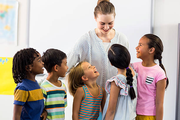 istock female teacher with schoolchildren 602326542