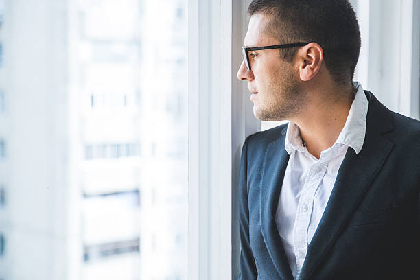 istock Businessman looking at the city 602328180