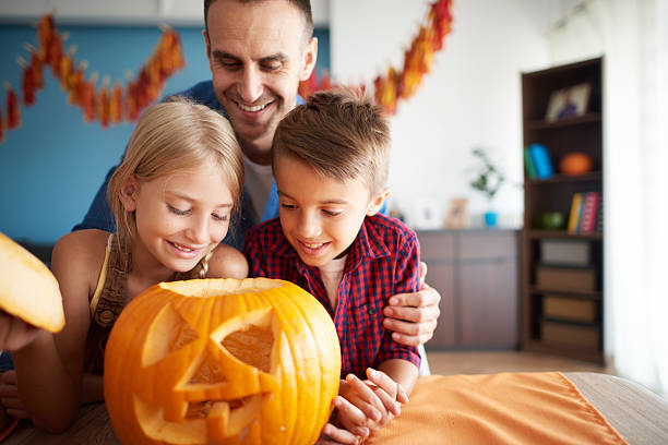 istock Happy family preparing to Halloween 602328776