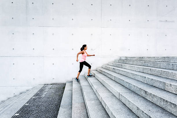 istock Woman running up steps in urban setting 602329148