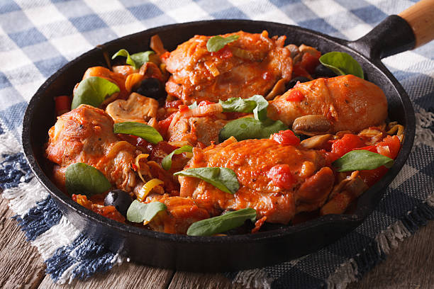 istock Chicken with tomatoes and vegetables closeup in a pan. horizontal 602330392