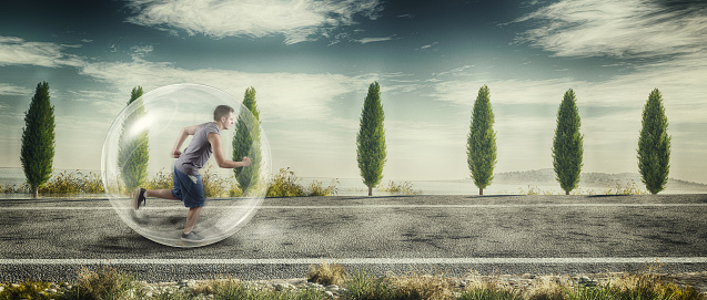 Athlete running on a highway into a bubble.