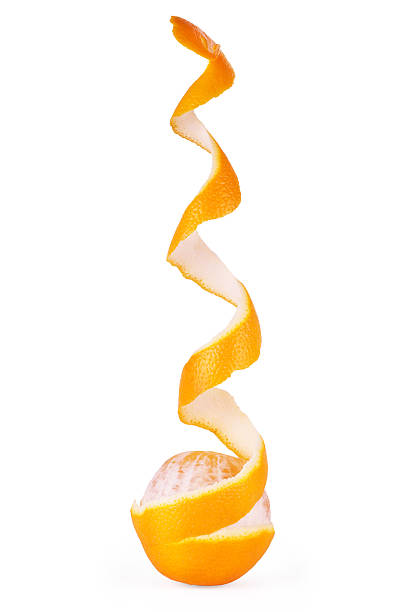 istock orange with peeled spiral skin isolated on white background 602333670