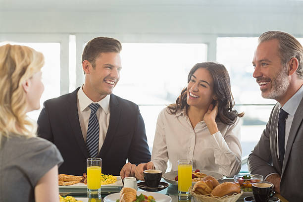 istock Business people having meal in restaurant 602335570